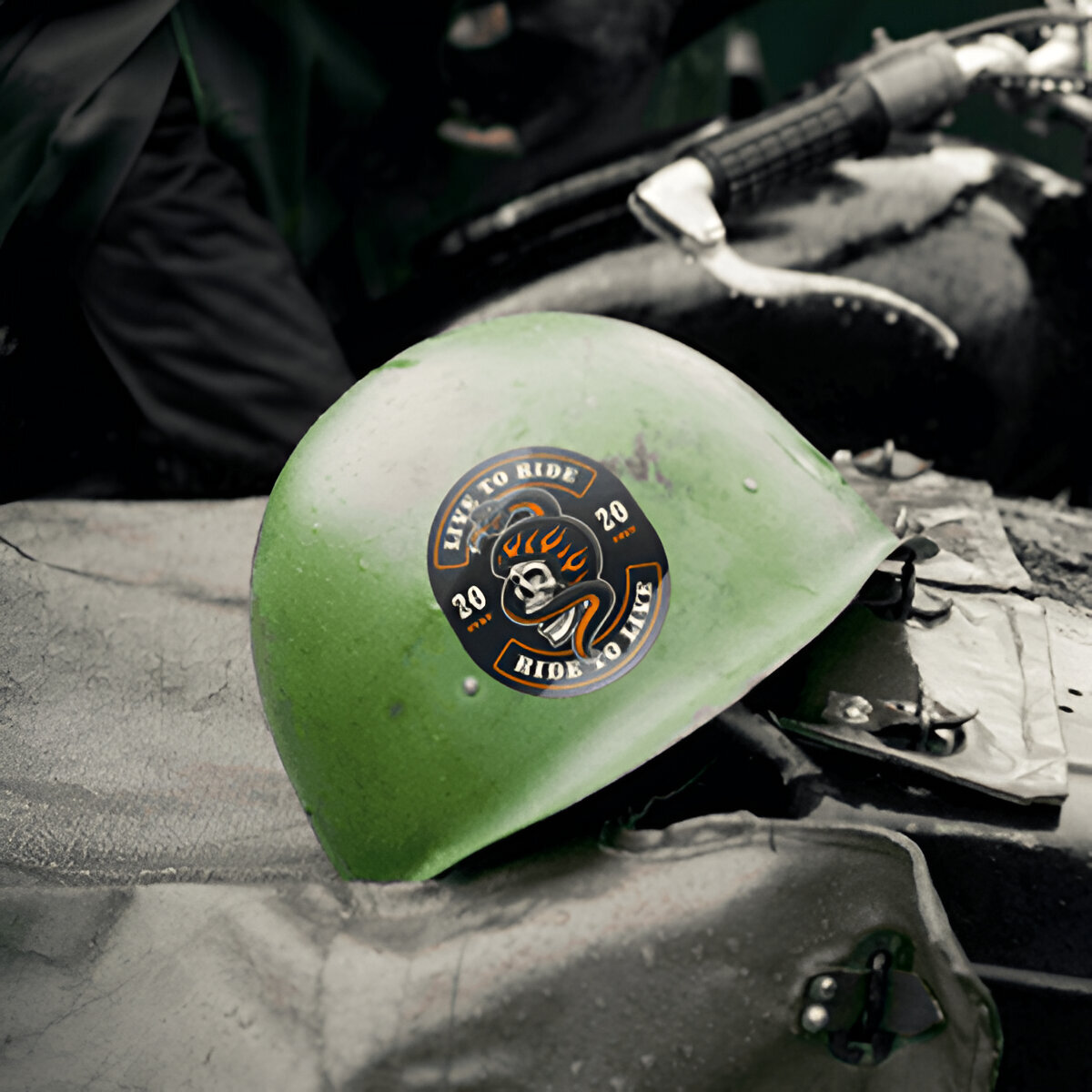 Sticker on green metallic hard hat helmet.