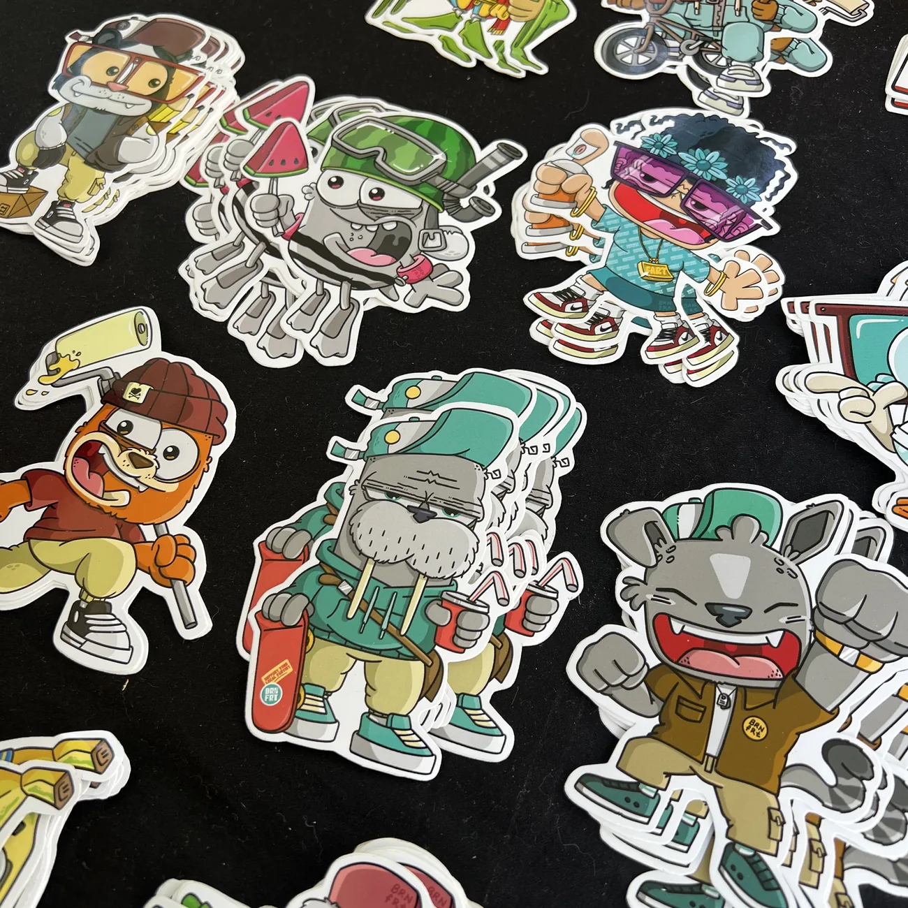 Brainfart x StickerApp die-cut stickers of cartoon characters in streetwear, including a walrus with a skateboard and a grinning cat