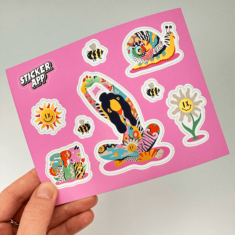 Sticker sheet on a pink background featuring colorful, quirky designs including a flower, bees, a snail, and an abstract character with a mix of vibrant patterns.